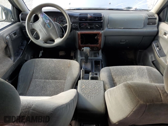 2001 Isuzu Rodeo S with VIN 4S2CK58W114317183, listed as a Copart auction lot 76280974 with 318,201 mi miles and Non Repairable. Bid and sale history available at DreamBid. Image 8.