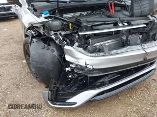 2023 Volkswagen Tiguan SE R-Line Black with VIN 3VV8B7AX3PM130610, listed as a IAAI auction lot 42011131 with 21,980 mi miles and . Bid and sale history available at DreamBid. Image 6.