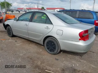 2004 Toyota Camry LE with VIN 4T1BE32K84U374943, listed as a IAAI auction lot 42038382 with 323,419 mi miles. Bid and sale history available at carsss.com. Image 3.