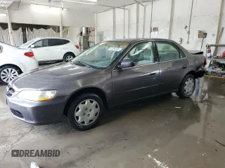 1999 Honda Accord LX with VIN 1HGCG564XXA013618, listed as a Copart auction lot 62064265 with 354,037 mi miles and Salvage title. Bid and sale history available at DreamBid. Image 1.