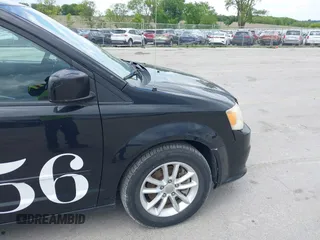 2014 Dodge Grand Caravan SXT z VIN 2C4RDGCGXER388459, wystawiony jako IAAI lot #42350937 z przebiegiem 149 276 mil mil oraz . Historia ofert i sprzedaży dostępna na DreamBid. Obrazek 13.