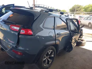 2014 Jeep Cherokee Trailhawk with VIN 1C4PJMBS5EW134900, listed as a IAAI auction lot 41997316 with 96,445 mi miles. Bid and sale history available at carsss.com. Image 4.
