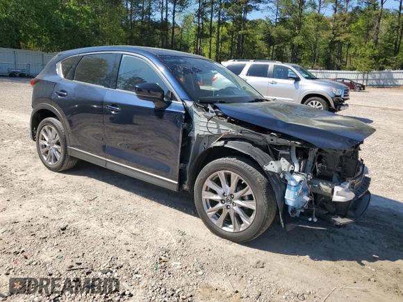 2019 Mazda CX-5 Grand Touring with VIN JM3KFBDMXK0540725, listed as a Copart auction lot 52395185 with 33,838 mi miles and Salvage Title. Bid and sale history available at carsss.com. Image 4.