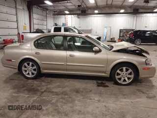 2002 Nissan Maxima GLE z VIN JN1DA31AX2T305310, wystawiony jako IAAI lot #42302521 z przebiegiem 68 920 mil mil oraz . Historia ofert i sprzedaży dostępna na DreamBid. Obrazek 13.