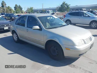 2004 Volkswagen Jetta GL z VIN 3VWRA69M64M039222, wystawiony jako IAAI lot #42262445 z przebiegiem 100 200 mil mil oraz . Historia ofert i sprzedaży dostępna na DreamBid. Obrazek 1.