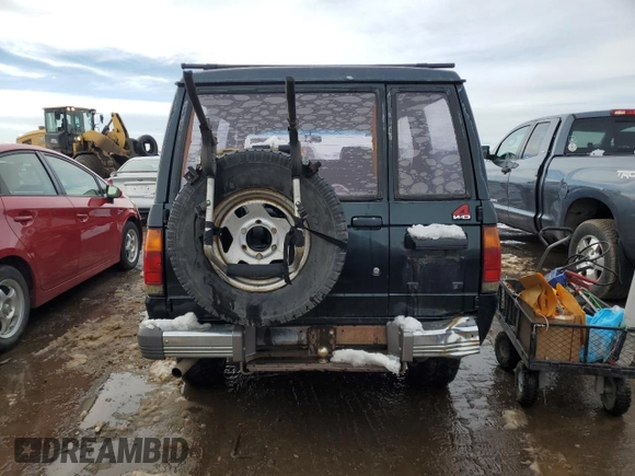 1991 Isuzu Trooper z VIN JACCH58E3M7900325, wystawiony jako Copart lot #79525294 z przebiegiem 146 593 mil mil oraz Czysty tytuł • Clean title. Historia ofert i sprzedaży dostępna na DreamBid. Obrazek 6.