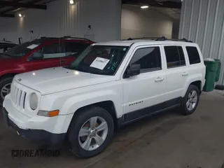 2014 Jeep Patriot Latitude with VIN 1C4NJPFA3ED618523, listed as a IAAI auction lot 41108657 with 124,035 mi miles and . Bid and sale history available at carsss.com. Image 2.