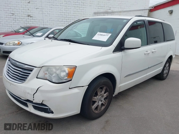 2013 Chrysler Town & Country Touring with VIN 2C4RC1BG4DR648838, listed as a IAAI auction lot 42004977 with 218,814 mi miles. Bid and sale history available at carsss.com. Image 2.