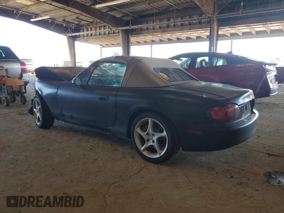 2003 Mazda MX-5 Miata Cloth with VIN JM1NB353730303334, listed as a Copart auction lot 51692615 with 142,789 mi miles and Salvage title. Bid and sale history available at DreamBid. Image 2.