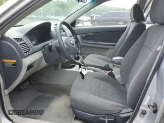 2005 Kia Spectra z VIN KNAFE162755170129, wystawiony jako Copart lot #60217065 z przebiegiem 94 458 mil mil oraz Szkoda całkowita • Salvage title. Historia ofert i sprzedaży dostępna na DreamBid. Obrazek 7.