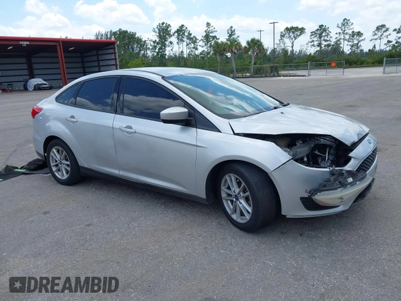 2018 Ford Focus SE z VIN 1FADP3FE9JL241661, wystawiony jako IAAI lot #42103513 z przebiegiem 117 003 mil mil oraz . Historia ofert i sprzedaży dostępna na DreamBid. Obrazek 1.