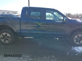2023 Ford F-150 Lightning Pro with VIN 1FTVW1EL7PWG07081, listed as a IAAI auction lot 38702102 with 9,976 mi miles and . Bid and sale history available at DreamBid. Image 13.