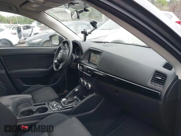 2016 Mazda CX-5 Sport with VIN JM3KE4BY9G0710004, listed as a IAAI auction lot 42323434 with 83,320 mi miles and . Bid and sale history available at DreamBid. Image 5.