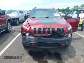 2014 Jeep Cherokee Trailhawk with VIN 1C4PJMBS7EW162357, listed as a IAAI auction lot 42601903 with 104,768 mi miles and . Bid and sale history available at DreamBid. Image 6.