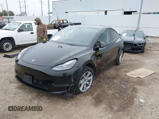 2023 Tesla Model Y Long Range z VIN 7SAYGDEEXPA181114, wystawiony jako IAAI lot #41564617 z przebiegiem 64 990 mil mil oraz . Historia ofert i sprzedaży dostępna na DreamBid. Obrazek 22.