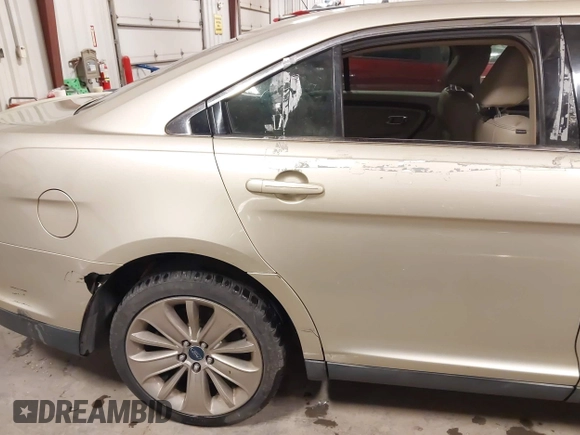 2010 Ford Taurus Limited with VIN 1FAHP2FW9AG133764, listed as a IAAI auction lot 41823527 with 243,477 mi miles and . Bid and sale history available at DreamBid. Image 18.