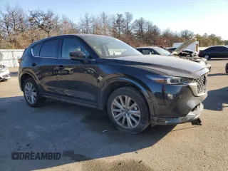 2023 Mazda CX-5 Signature with VIN JM3KFBXYXP0130139, listed as a Copart auction lot 88321445 with 22,911 mi miles and Salvage Title. Bid and sale history available at carsss.com. Image 4.