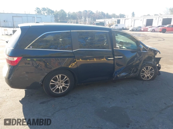 2011 Honda Odyssey EX-L with VIN 5FNRL5H61BB059275, listed as a IAAI auction lot 41293690 with 105,511 mi miles and . Bid and sale history available at carsss.com. Image 13.