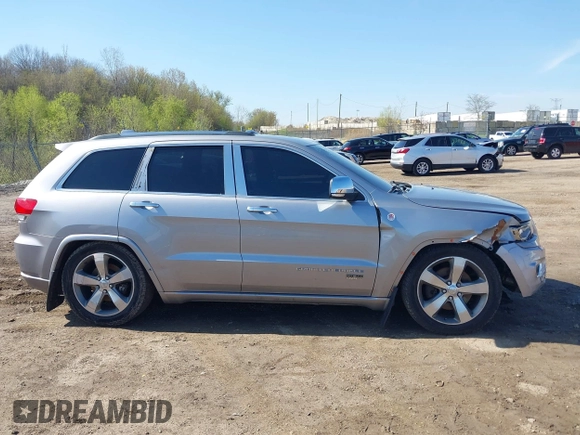 2014 Jeep Grand Cherokee Overland with VIN 1C4RJFCT9EC231840, listed as a IAAI auction lot 42114284 with 170,691 mi miles and . Bid and sale history available at DreamBid. Image 13.
