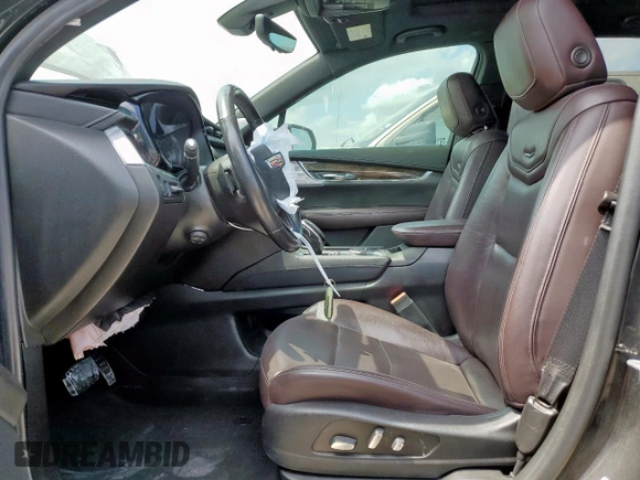 2020 Cadillac XT6 FWD Premium Luxury с VIN 1GYKPCRSXLZ104502, выставлен на аукционе Copart как лот 58211275 с пробегом 97 053 миль миль и Списание • Salvage title. История ставок и продаж доступна на DreamBid. Изображение 7.
