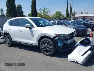 2018 Mazda CX-5 Touring with VIN JM3KFACM0J0416716, listed as a IAAI auction lot 42150121 with 61,332 mi miles and . Bid and sale history available at carsss.com. Image 1.