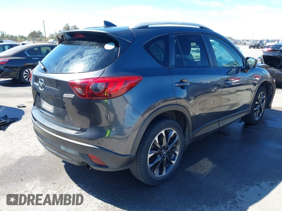 2016 Mazda CX-5 Grand Touring with VIN JM3KE2DY9G0824196, listed as a IAAI auction lot 41801887 with 88,625 mi miles. Bid and sale history available at carsss.com. Image 4.