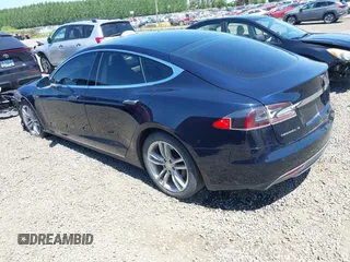 2014 Tesla Model S 60 with VIN 5YJSA1H18EFP31969, listed as a IAAI auction lot 42312485 with 90,043 mi miles and . Bid and sale history available at DreamBid. Image 3.