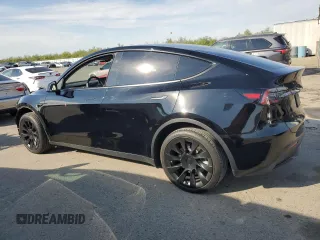 2023 Tesla Model Y Long Range with VIN 7SAYGDEE5PF834645, listed as a Copart auction lot 48596925 with 26,896 mi miles and Salvage Title. Bid and sale history available at DreamBid. Image 2.