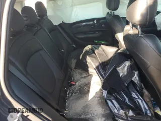 2018 MINI Clubman Cooper S with VIN WMWLN9C57J2E50986, listed as a Copart auction lot 77597404 with 107,606 mi miles and Salvage Title. Bid and sale history available at carsss.com. Image 10.