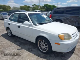 2003 Hyundai Accent GL z VIN KMHCG45C53U468978, wystawiony jako IAAI lot #41999193 z przebiegiem 105 514 mil mil oraz . Historia ofert i sprzedaży dostępna na DreamBid. Obrazek 1.