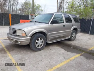 2001 Oldsmobile Bravada z VIN 1GHDT13WX12110603, wystawiony jako IAAI lot #41911383 z przebiegiem 164 916 mil mil oraz . Historia ofert i sprzedaży dostępna na DreamBid. Obrazek 2.