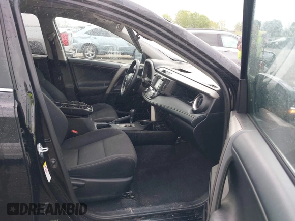 2018 Toyota RAV4 XLE with VIN 2T3WFREV9JW412755, listed as a IAAI auction lot 41889960 with 216,451 mi miles and . Bid and sale history available at carsss.com. Image 5.