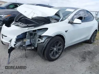 2024 Tesla Model Y with VIN 7SAYGDED2RF207783, listed as a IAAI auction lot 41758143 with Not Provided miles and . Bid and sale history available at DreamBid. Image 2.