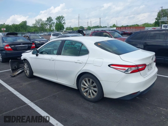2019 Toyota Camry LE with VIN 4T1B11HK2KU743445, listed as a IAAI auction lot 42129688 with 284,938 mi miles and . Bid and sale history available at DreamBid. Image 3.