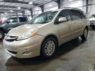 2010 Toyota Sienna XLE with VIN 5TDYK4CC9AS297214, listed as a Copart auction lot 58168805 with 166,970 mi miles and Salvage title. Bid and sale history available at DreamBid. Image 1.