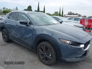 2024 Mazda CX-30 S Preferred z VIN 3MVDMBCM9RM635307, wystawiony jako IAAI lot #42099565 z przebiegiem 9 290 mil mil oraz . Historia ofert i sprzedaży dostępna na DreamBid. Obrazek 1.
