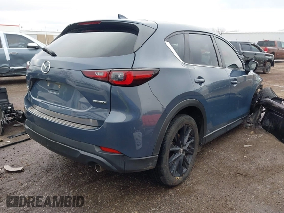 2023 Mazda CX-5 S Carbon Edition z VIN JM3KFBCM9P0109219, wystawiony jako IAAI lot #41183435 z przebiegiem Nie podano mil oraz . Historia ofert i sprzedaży dostępna na DreamBid. Obrazek 4.