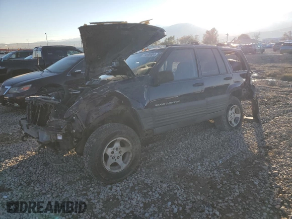 1997 Jeep Grand Cherokee Laredo with VIN 1J4GZ58Y0VC547880, listed as a Copart auction lot 79866684 with 0 mi miles and Salvage Title. Bid and sale history available at carsss.com. Image 1.