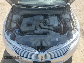 2015 Lincoln MKZ Hybrid z VIN 3LN6L2LU1FR617875, wystawiony jako Copart lot #55761545 z przebiegiem 75 321 mil mil oraz Szkoda całkowita • Salvage title. Historia ofert i sprzedaży dostępna na DreamBid. Obrazek 11.