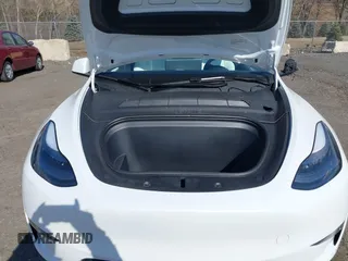 2024 Tesla Model Y with VIN 7SAYGDED2RF089010, listed as a IAAI auction lot 41630222 with 18,366 mi miles and . Bid and sale history available at carsss.com. Image 10.