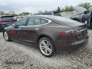 2014 Tesla Model S 60 with VIN 5YJSA1H19EFP51003, listed as a Copart auction lot 52164335 with 105,926 mi miles and Salvage Title. Bid and sale history available at DreamBid. Image 2.