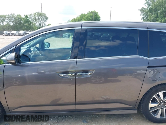 2014 Honda Odyssey Touring with VIN 5FNRL5H99EB138952, listed as a IAAI auction lot 42538833 with 146,959 mi miles and . Bid and sale history available at DreamBid. Image 14.
