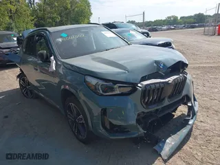 2023 BMW X1 xDrive28i with VIN WBX73EF09P5X16180, listed as a IAAI auction lot 40064342 with 7,636 mi miles. Bid and sale history available at carsss.com. Image 1.