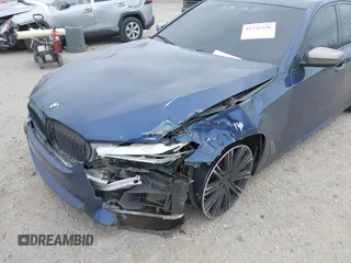2018 BMW 5 Series M550i xDrive with VIN WBAJB9C56JG463891, listed as a IAAI auction lot 41731556 with 104,860 mi miles. Bid and sale history available at carsss.com. Image 6.