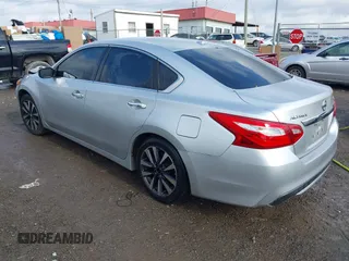 2016 Nissan Altima SV with VIN 1N4AL3AP0GC262897, listed as a IAAI auction lot 41063385 with 157,331 mi miles and . Bid and sale history available at DreamBid. Image 3.