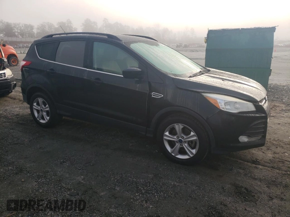2014 Ford Escape SE with VIN 1FMCU9GX2EUC86115, listed as a Copart auction lot 82810324 with 212,346 mi miles and Salvage Title. Bid and sale history available at DreamBid. Image 4.