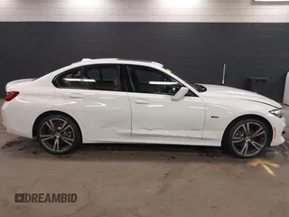 2023 BMW 3 Series 330e xDrive with VIN 3MW39FS05P8D20575, listed as a IAAI auction lot 42076033 with 10,875 mi miles. Bid and sale history available at carsss.com. Image 6.