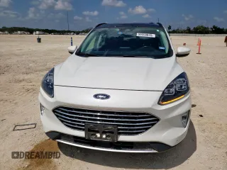 2021 Ford Escape Titanium Hybrid z VIN 1FMCU0DZ6MUA03327, wystawiony jako Copart lot #59558845 z przebiegiem 67 569 mil mil oraz Czysty tytuł • Clean title. Historia ofert i sprzedaży dostępna na DreamBid. Obrazek 5.
