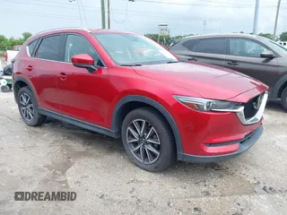 2018 Mazda CX-5 Grand Touring z VIN JM3KFADM5J0437365, wystawiony jako IAAI lot #42657919 z przebiegiem 96 760 mil mil oraz . Historia ofert i sprzedaży dostępna na DreamBid. Obrazek 1.
