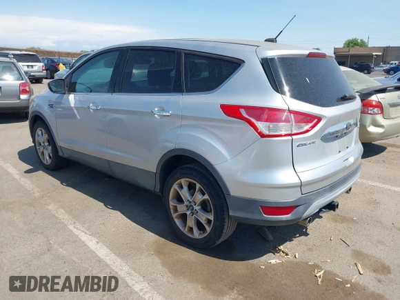 2013 Ford Escape SEL z VIN 1FMCU9H95DUC87631, wystawiony jako IAAI lot #42564756 z przebiegiem 144 467 mil mil oraz . Historia ofert i sprzedaży dostępna na DreamBid. Obrazek 3.